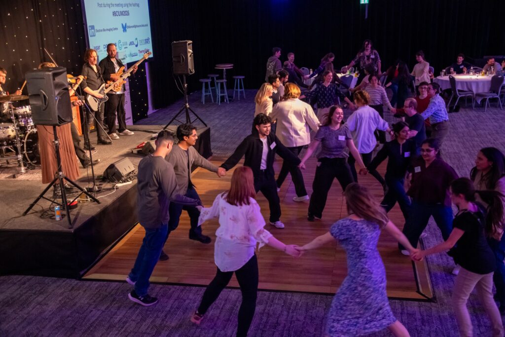 Delegates dancing in Celidh with band in background